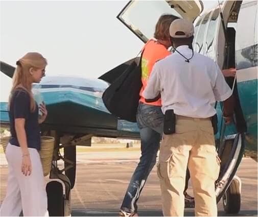 people boarding small airplane