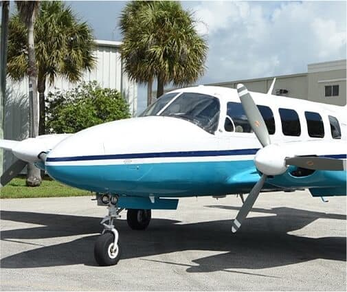 front view of propeller airplane on tarmack